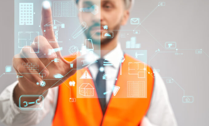 Architect working with virtual 3D projection. Close up of architect wearing reflective vest and helmet. Selective focus of digital tactile charts screen, man touching virtual icon on projection. Concept of digitalization, construction.